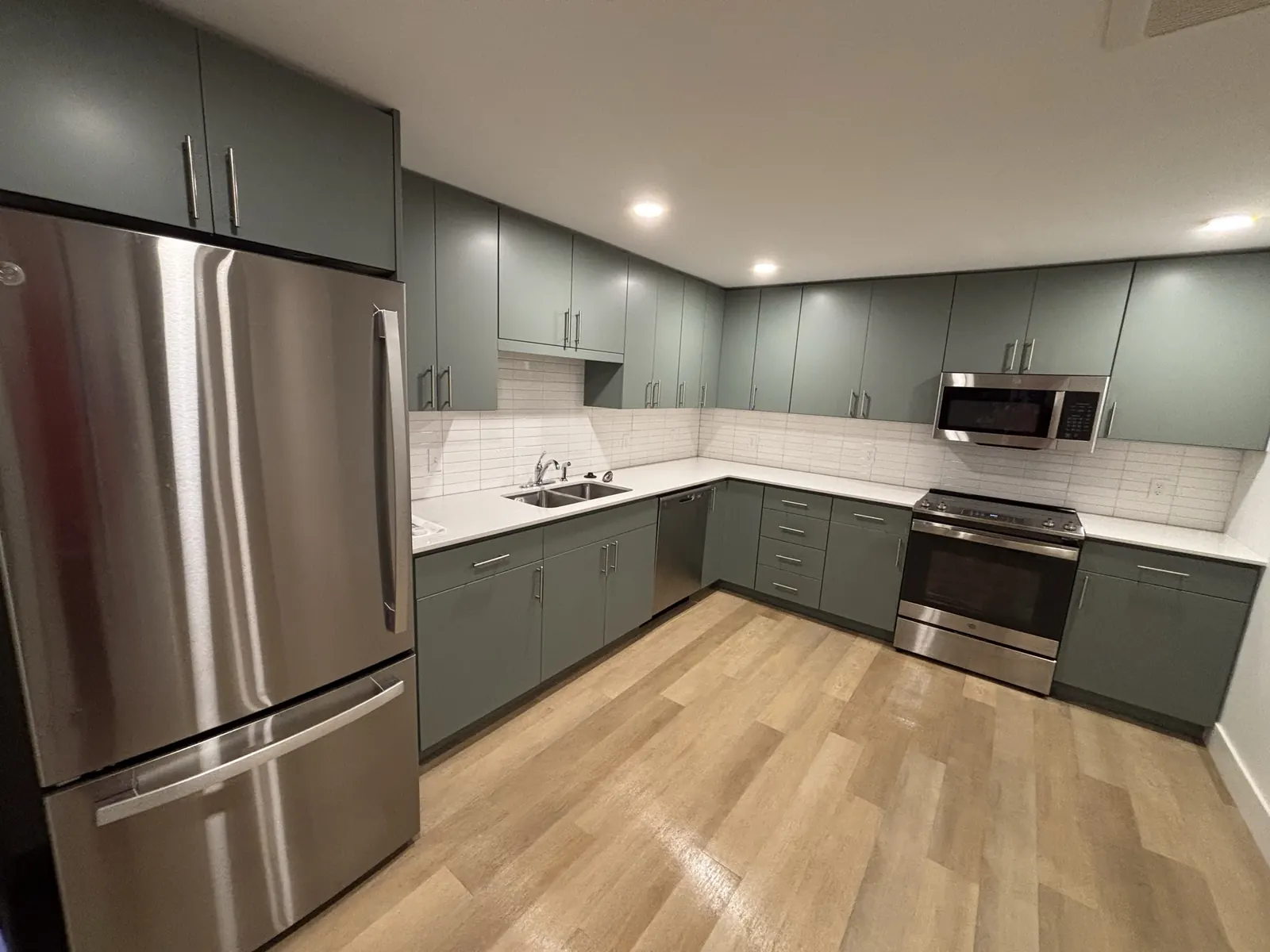 Spotless kitchen with clean counters, appliances and floors